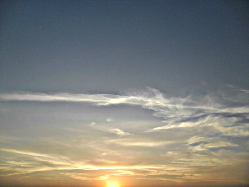Sun Setting Behind Clouds — Blue, Serene, Sunset, Photograph