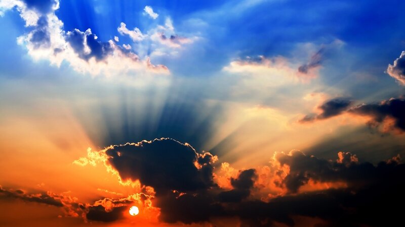 Sun Setting Behind Clouds — Blue, Sky