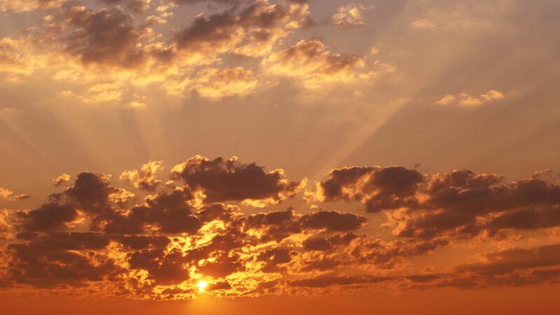 Sun Setting Behind Clouds — Dramatic, Photograph