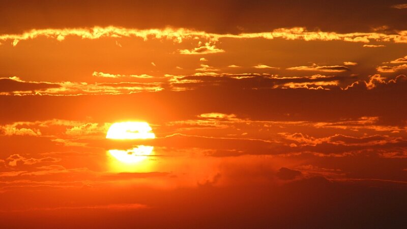 Sun Setting Behind Clouds — Dramatic, Sky