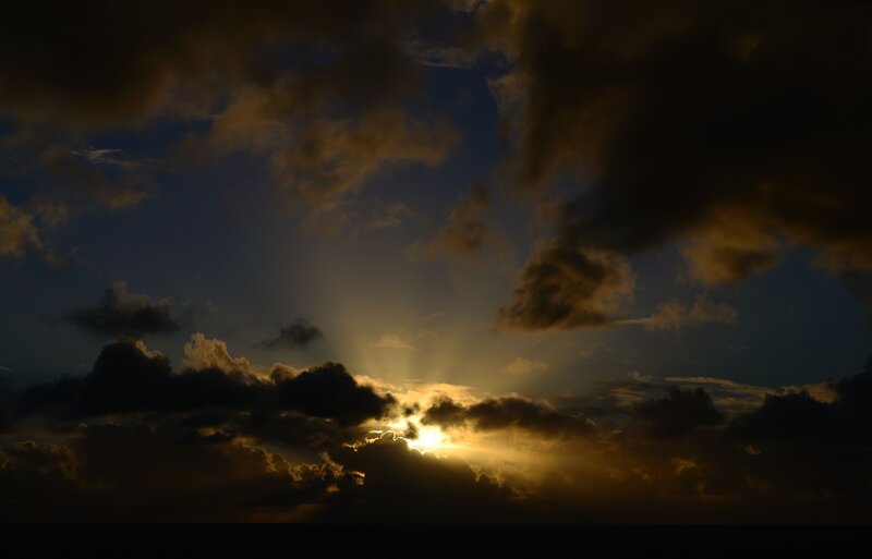 Sun Setting Behind Clouds — Gold, Dramatic, Sunset