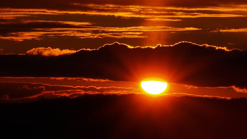Sun Setting Behind Clouds — Orange, Black