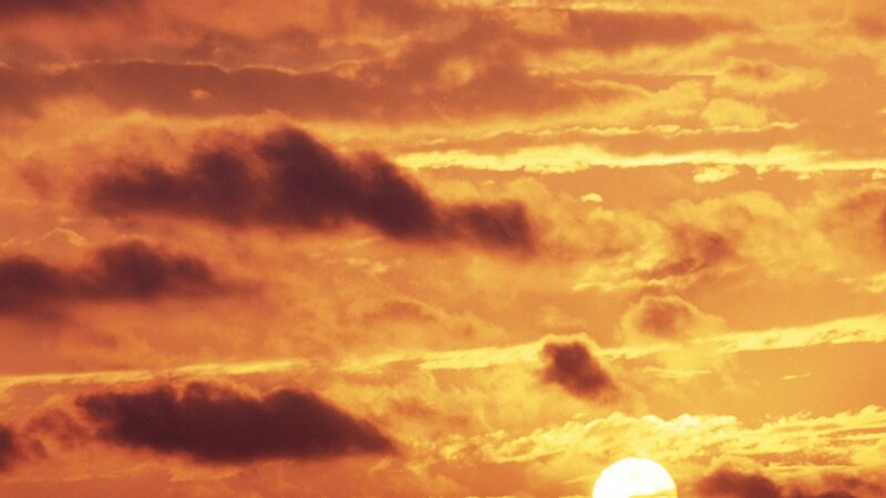 Sun Setting Behind Clouds — Orange, Brown