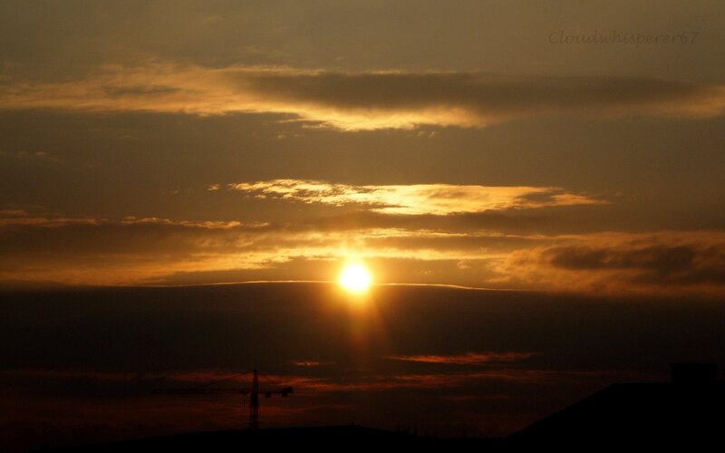 Sun Setting Behind Clouds — Orange, Dramatic, Sunset, Photograph, Crane