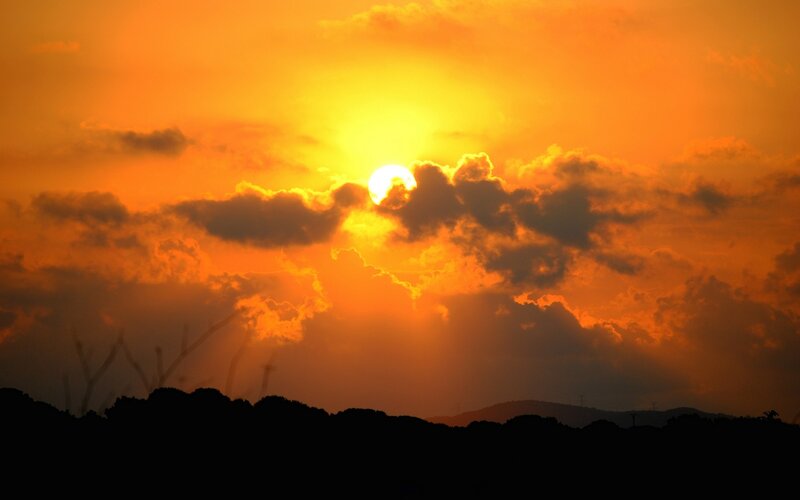 Sun Setting Behind Clouds — Orange, Dramatic, Sunset, Photograph, Mountains, Silhouette