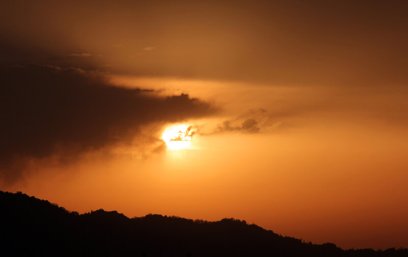 Sun Setting Behind Clouds — Orange, Dramatic, Sunset, Photograph, Mountains, Sky