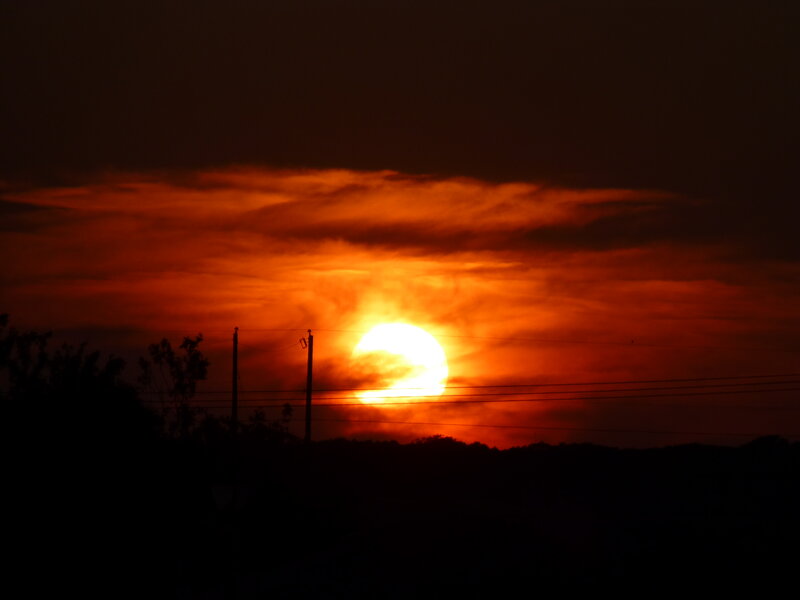 Sun Setting Behind Clouds — Orange, Dramatic, Sunset, Photograph, Power Lines