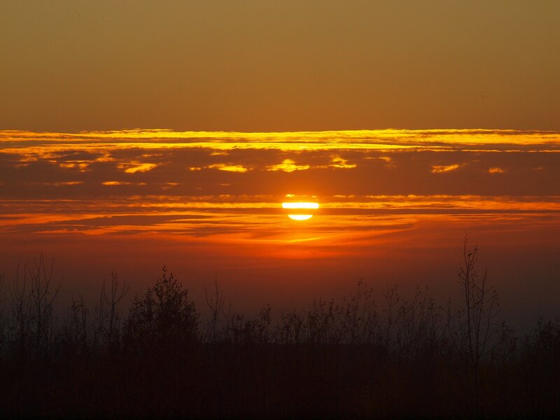 Sun Setting Behind Clouds — Orange, Dramatic, Sunset, Photograph, Silhouette