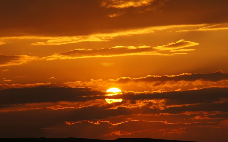 Sun Setting Behind Clouds — Orange, Dramatic, Sunset, Photograph, Sky, Horizon, Yellow, Black