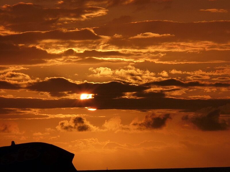 Sun Setting Behind Clouds — Orange, Dramatic, Sunset, Photograph, Sky, Silhouette
