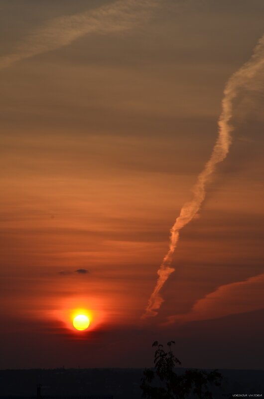 Sun Setting Behind Clouds — Orange, Dramatic, Sunset, Photograph, Tree Silhouette