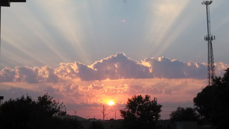 Sun Setting Behind Clouds — Orange, Dramatic, Sunset, Photograph, Trees, Tower