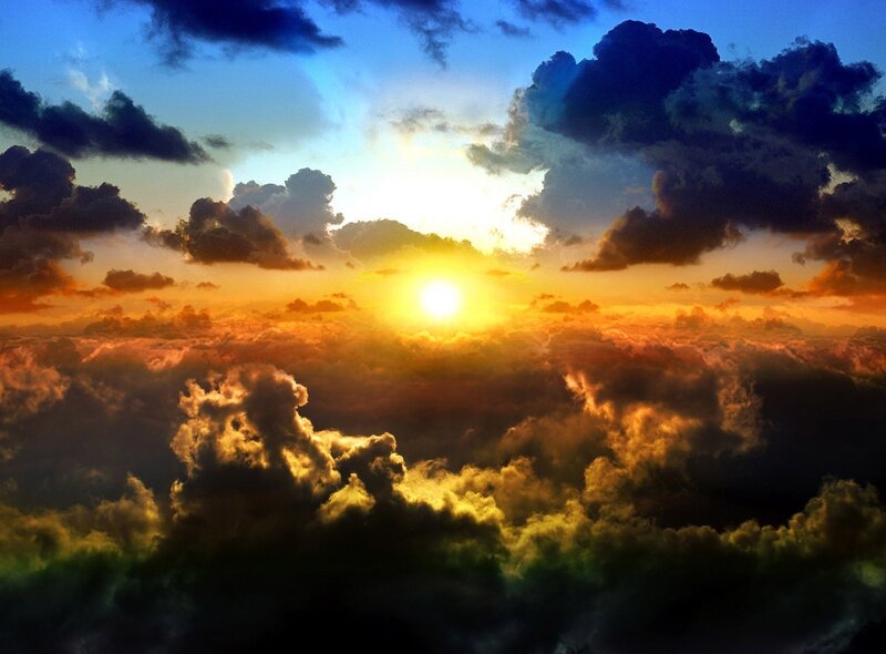 Sun Setting Behind Clouds — Orange