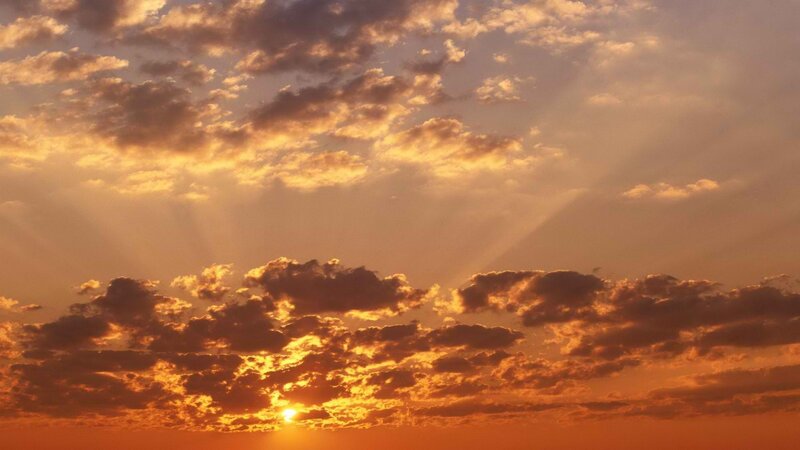 Sun Setting Behind Clouds — Orange, Yellow