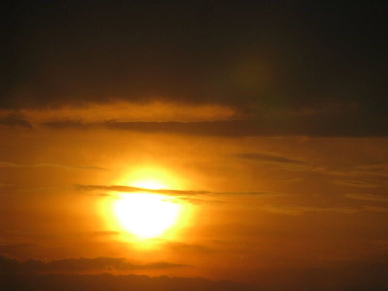 Sun Setting Behind Clouds — Photograph, Sky