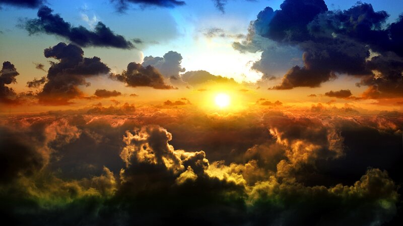 Sun Setting Behind Clouds — Photograph