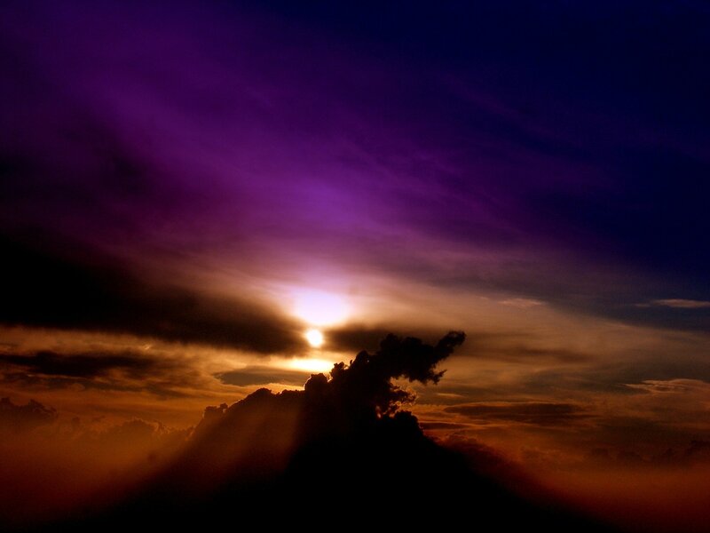Sun Setting Behind Clouds — Purple, Dramatic, Sunset