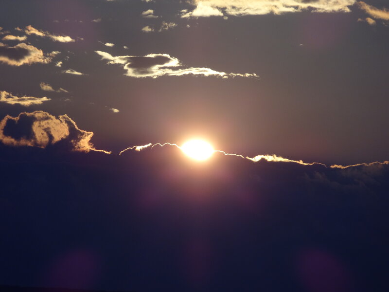 Sun Setting Behind Clouds — Purple, Dramatic