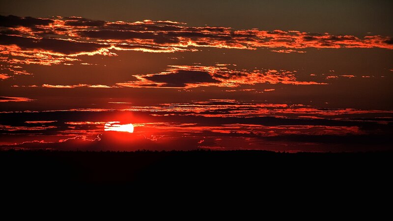 Sun Setting Behind Clouds — Red, Dramatic, Sunset, Photograph, Horizon