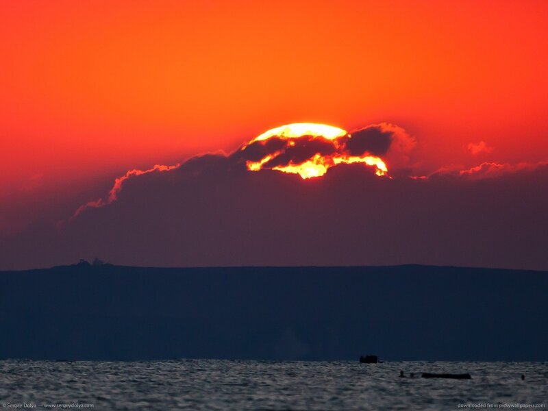 Sun Setting Behind Clouds — Red, Dramatic, Sunset, Photograph, Sea