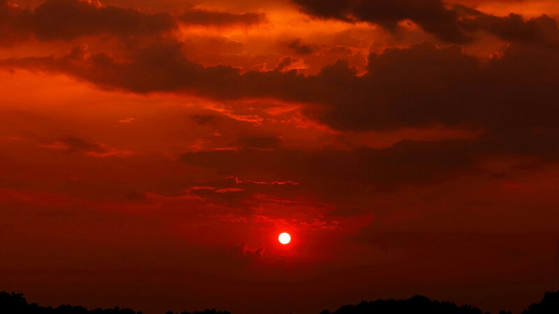 Sun Setting Behind Clouds — Red, Dramatic, Sunset, Photograph