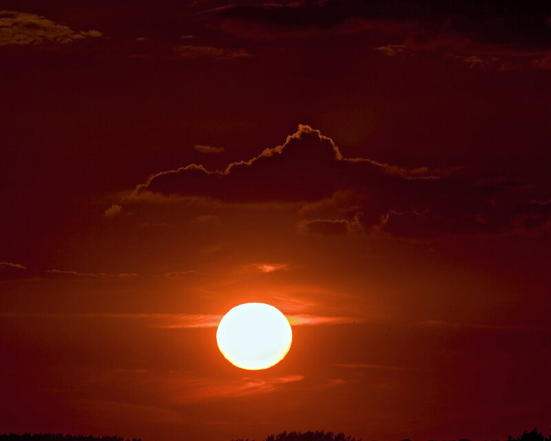Sun Setting Behind Clouds — Red, Dramatic, Sunset