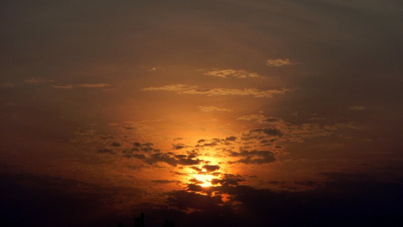 Sun Setting Behind Clouds — Sky, Yellow