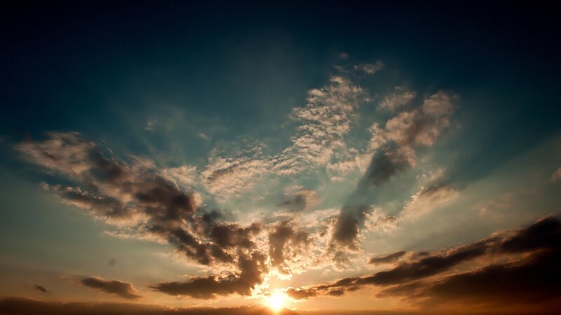 Sun Setting Behind Clouds — White