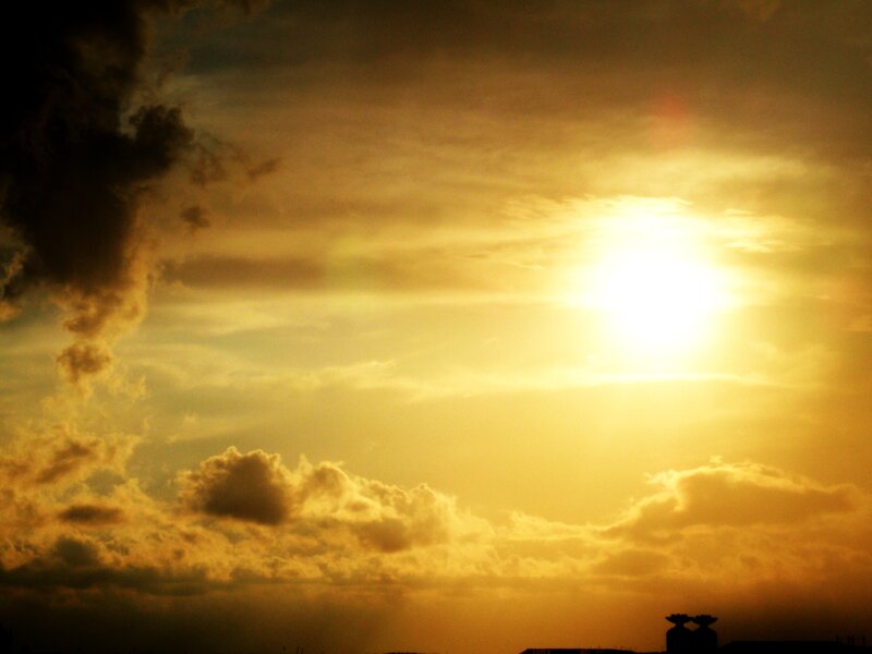 Sun Setting Behind Clouds — Yellow, Dramatic, Sunset, Photograph, Sky, Silhouette