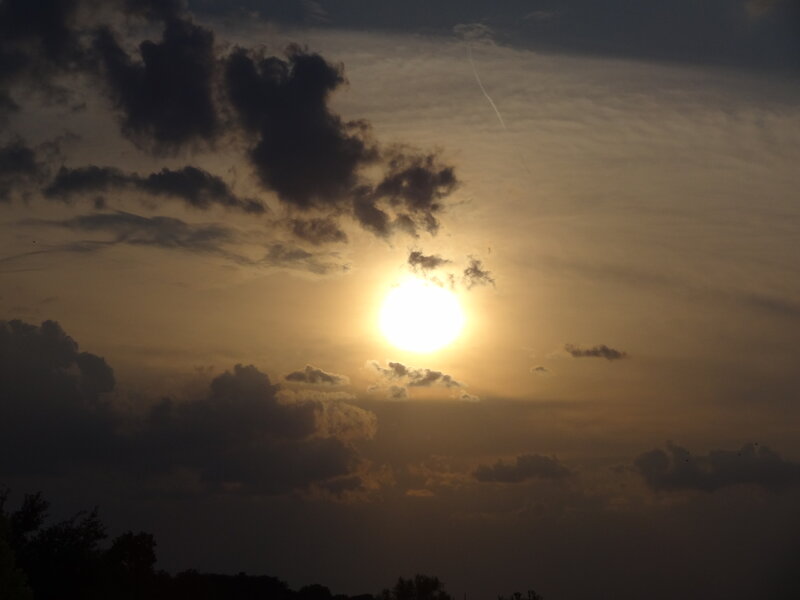 Sun Setting Behind Clouds — Yellow, Dramatic, Sunset