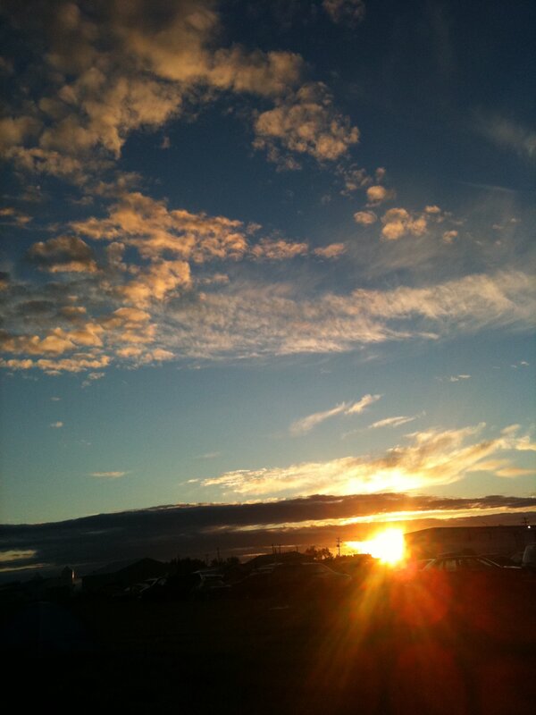 Sun Setting Behind Hills — Blue
