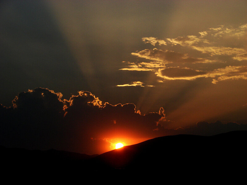 Sun Setting Behind Hills — Orange, Dramatic