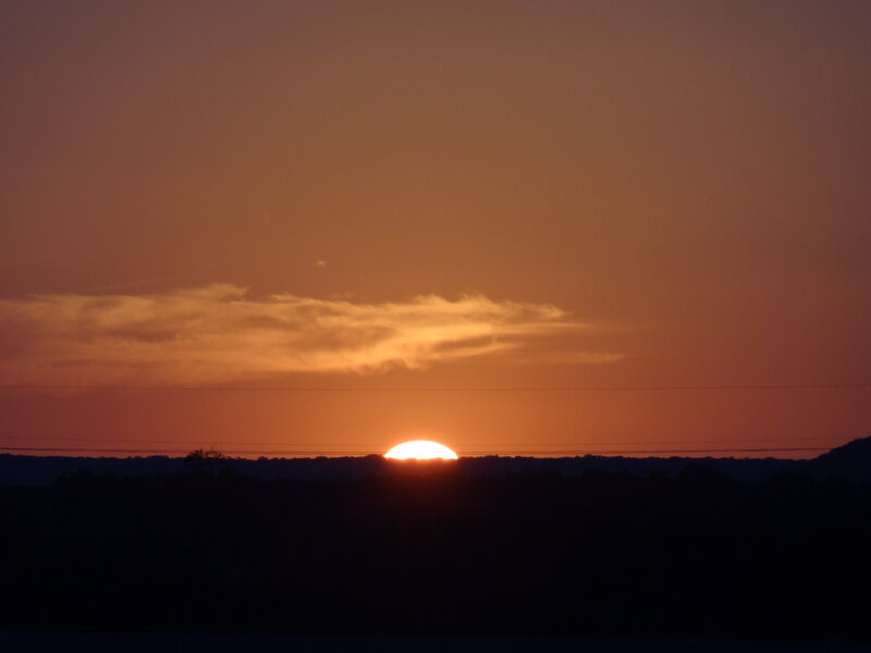 Sun Setting Behind Hills — Orange, Serene, Sunset, Photograph, Clouds