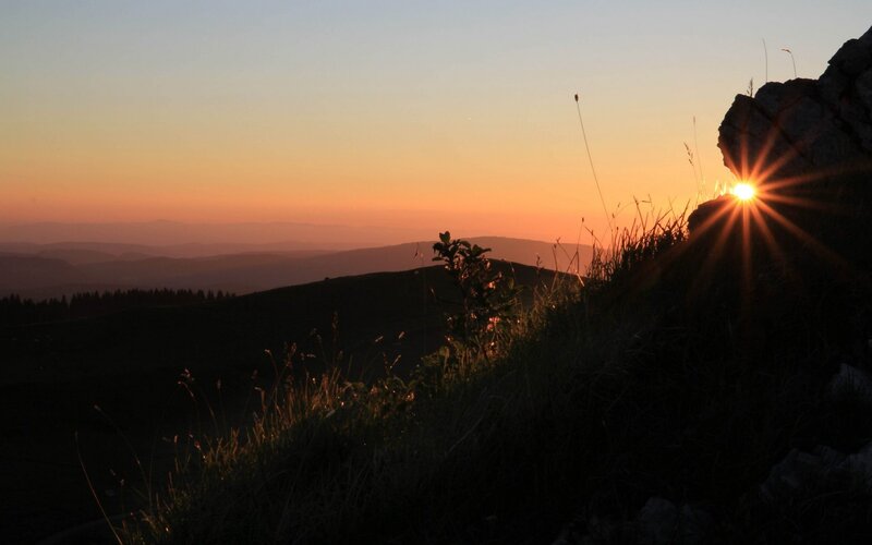Sun Setting Behind Hills — Orange, Serene, Sunset, Photograph, Grass
