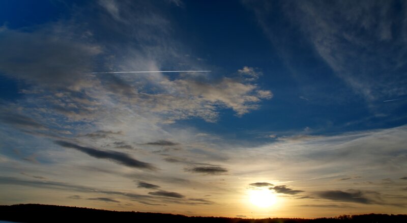 Sun Setting Behind Hills