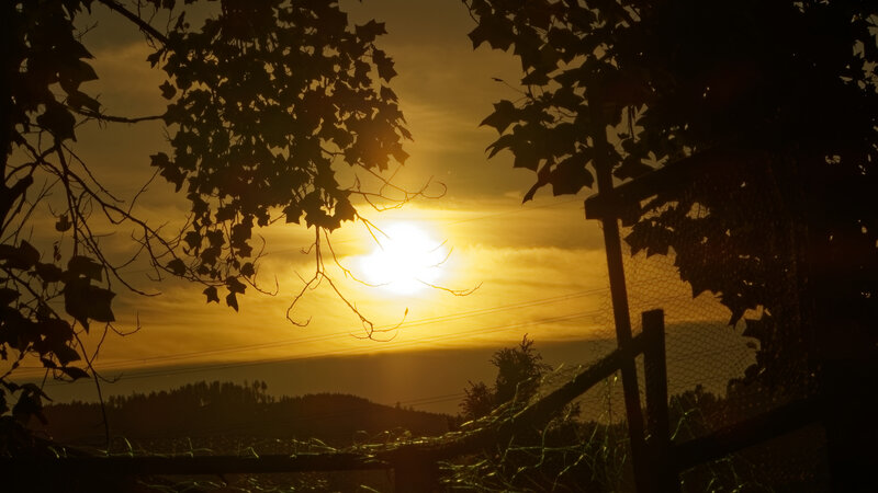 Sun Setting Behind Hills — Yellow
