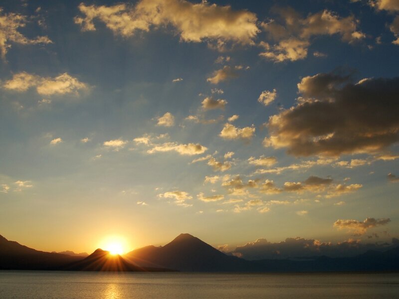 Sun Setting Behind Mountains — Blue