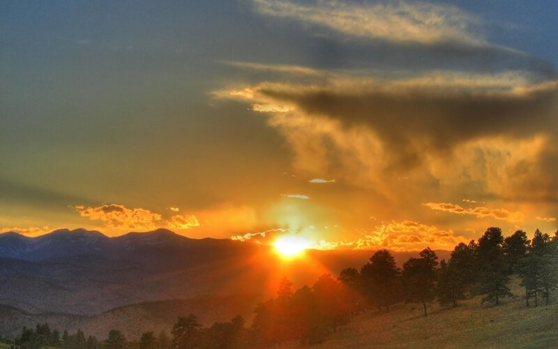 Sun Setting Behind Mountains — Dramatic