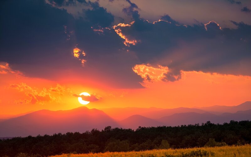 Sun Setting Behind Mountains — Orange, Dramatic, Sunset, Photograph, Clouds, Forest