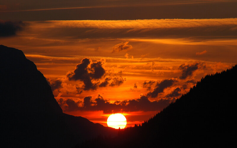 Sun Setting Behind Mountains — Orange, Dramatic, Sunset, Photograph, Clouds