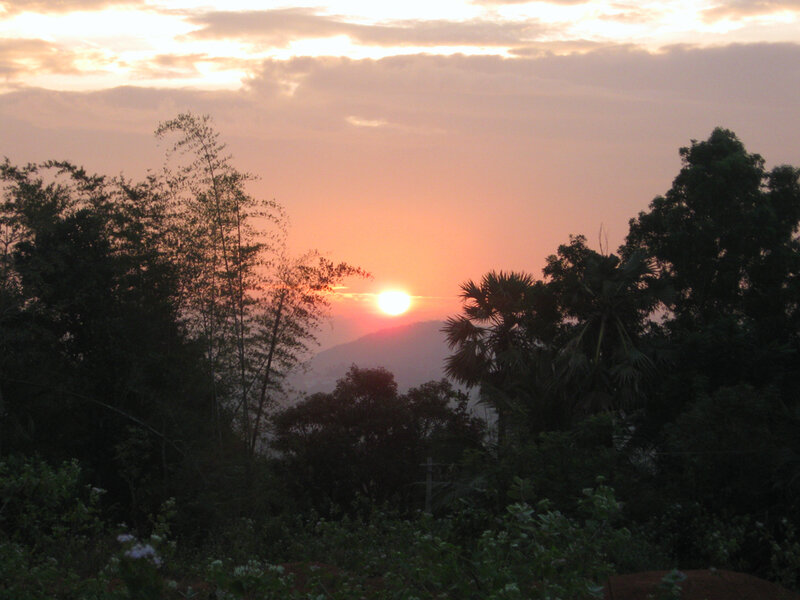 Sun Setting Behind Mountains — Orange, Serene