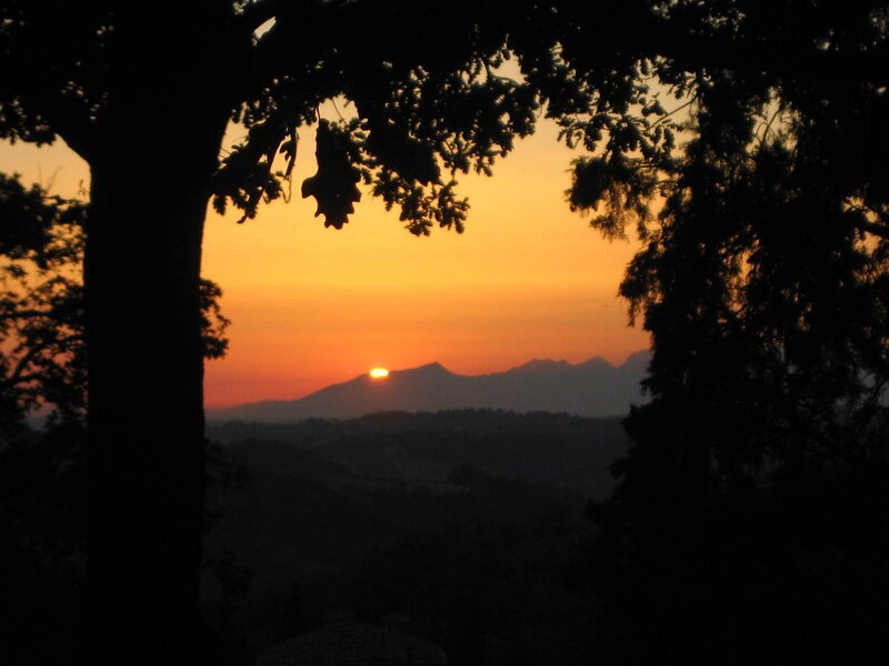 Sun Setting Behind Mountains — Orange