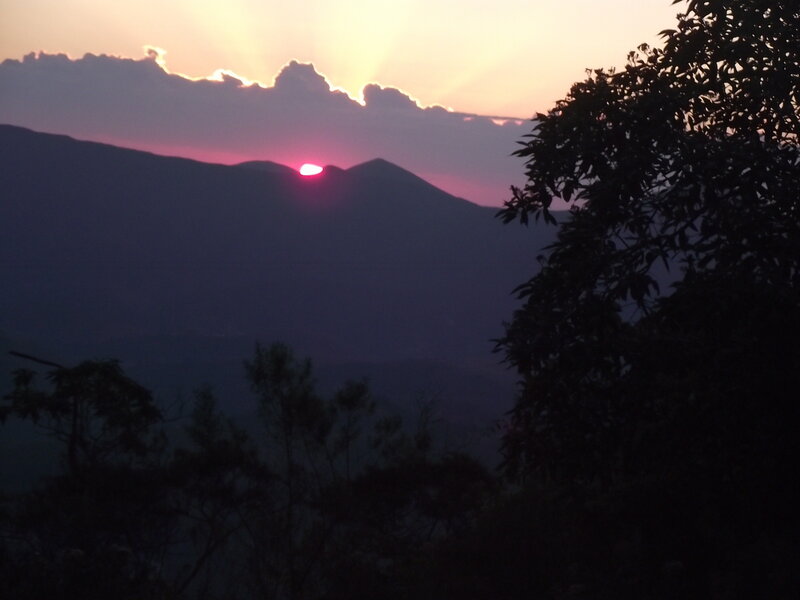 Sun Setting Behind Mountains — Purple