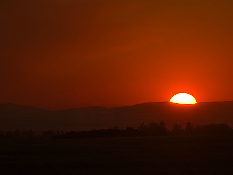 Sun Setting Behind Mountains — Red, Dramatic, Sunset, Photograph, Trees