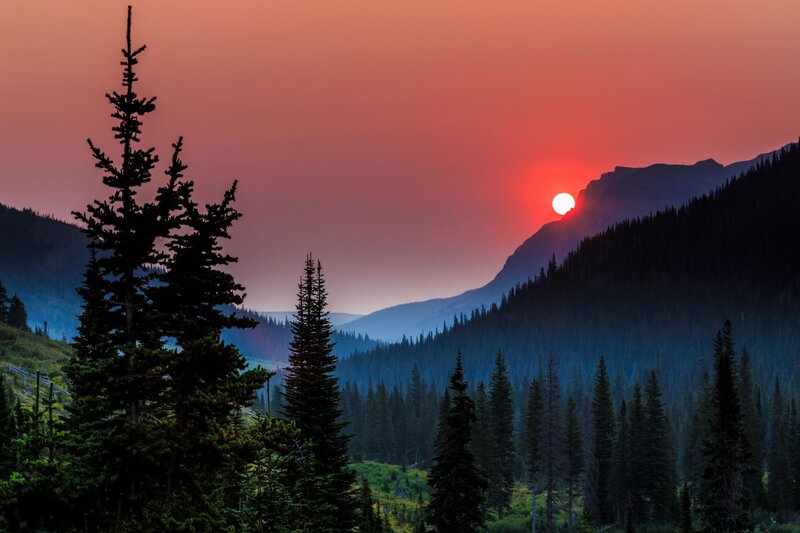 Sun Setting Behind Mountains — Red, Dramatic