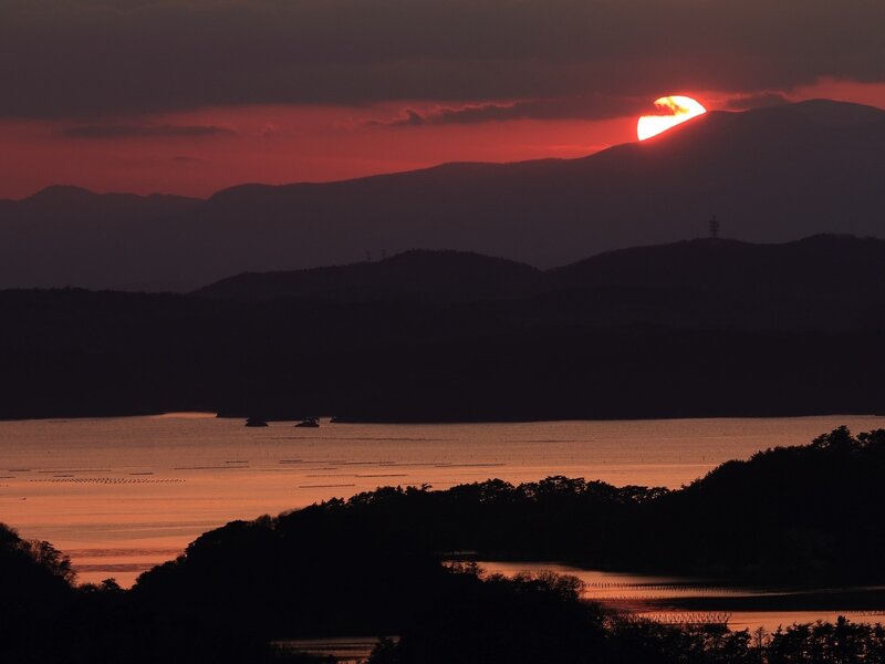 Sun Setting Behind Mountains — Red