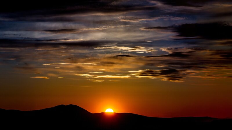 Sun Setting Behind Mountains — Sunset
