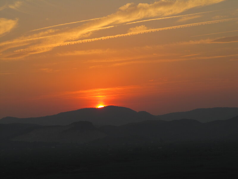 Sun Setting Behind Mountains