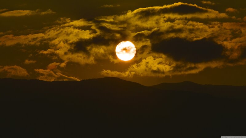 Sun Setting Behind Mountains — Yellow, Dramatic