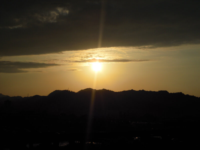 Sun Setting Behind Mountains — Yellow